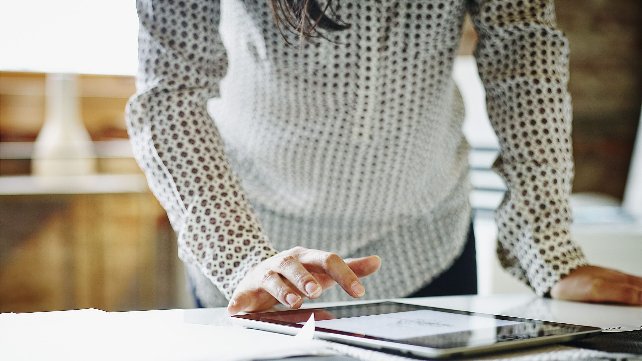 Businesswoman looking at digital tablet in office