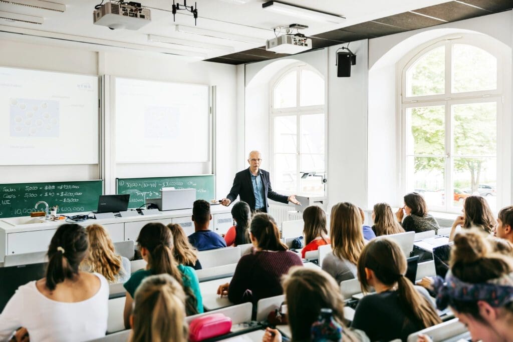 University Professor Addressing His Pupils During Lecture