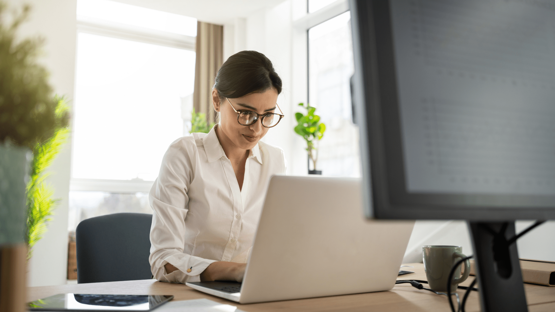 Stock - People - Woman Typing on Laptop